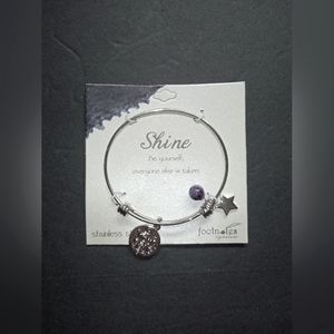 New shine bracelet by foot notes. 3 charms. Silver tone.